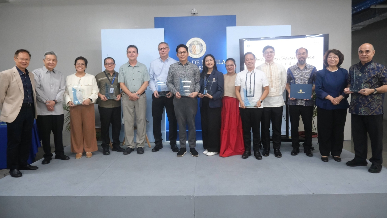 Ateneo de Manila University President Fr Roberto Yap SJ, Vice President for Education Dr Maria Luz C Vilches, and Assistant Vice President for Research, Creative Work, and Innovation Dr Filomeno Aguilar Jr (center) are flanked by (L-R) Ateneo School of Government Dean Dr Jennifer Oreta, School of Science and Engineering Dean Dr Raphael Guerrero, John Gokongwei School of Management Dean Dr Roberto Martin Galang, Rosita G. Leong School of Social Sciences Dean Dr Czarina Saloma-Akpedonu, School of Humanities Dean Dr Patricia Lambino, and Gokongwei Brothers School of Education and Learning Design Acting Dean Dr Maria Isabel Martin at the 2026 University Scholarly Work Awards. PHOTO: Rafa Lopez, OAVP-RCWI