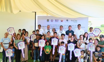 DHSUD Secretary Jose Ramon P. Aliling, Pag-IBIG Fund Chief Executive Officer Marilene B. Acosta, and P.A. Properties Chairman of the Board Romarico T. Alvarez joined beneficiaries of the Expanded Pambansang Pabahay para sa Pilipino (4PH) Program during the housing unit turnover ceremony at Nuvista Homes Lipa, Batangas